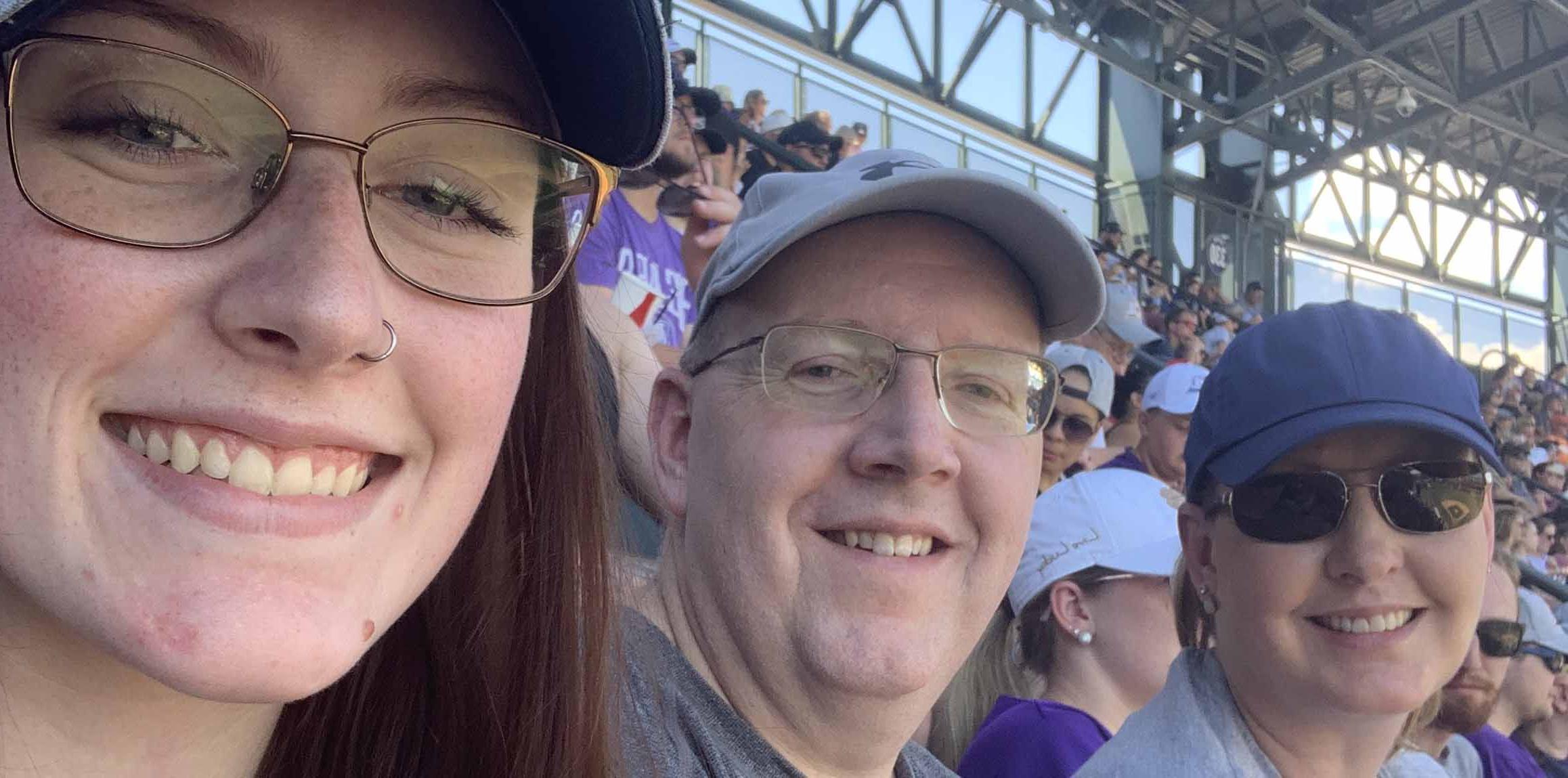 Hannah Rueter and her parents, Wade and Sharon, at UNC Day at the Rockies.